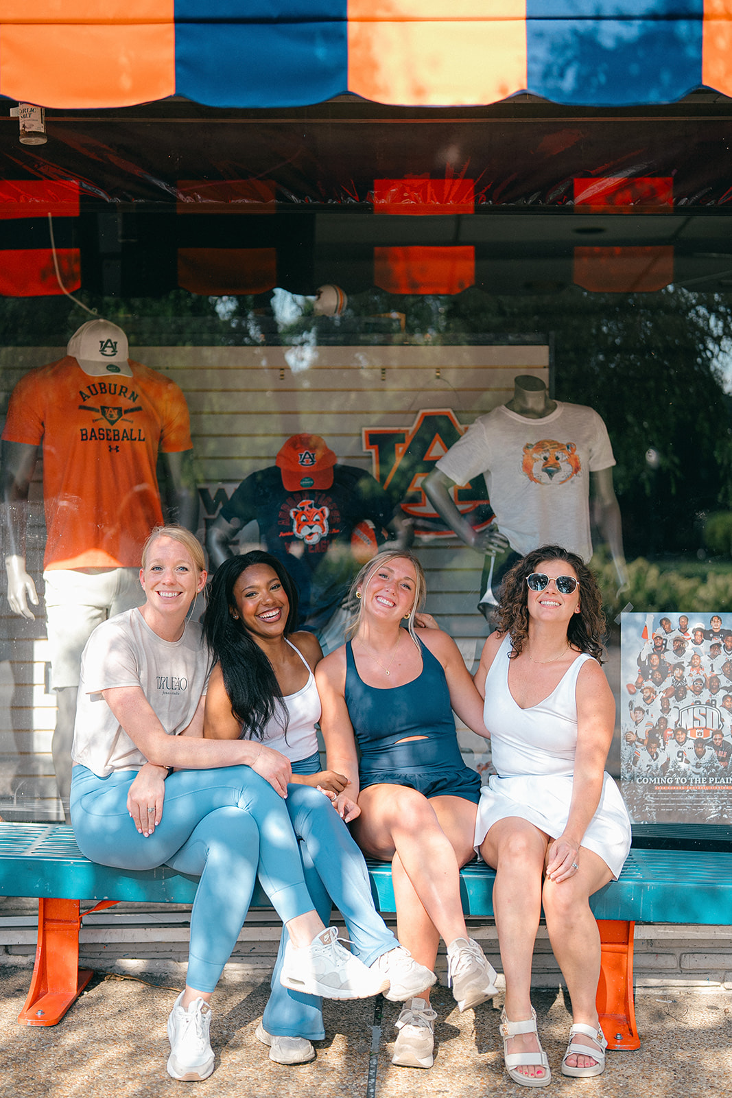 women sitting on bench in downtown auburn