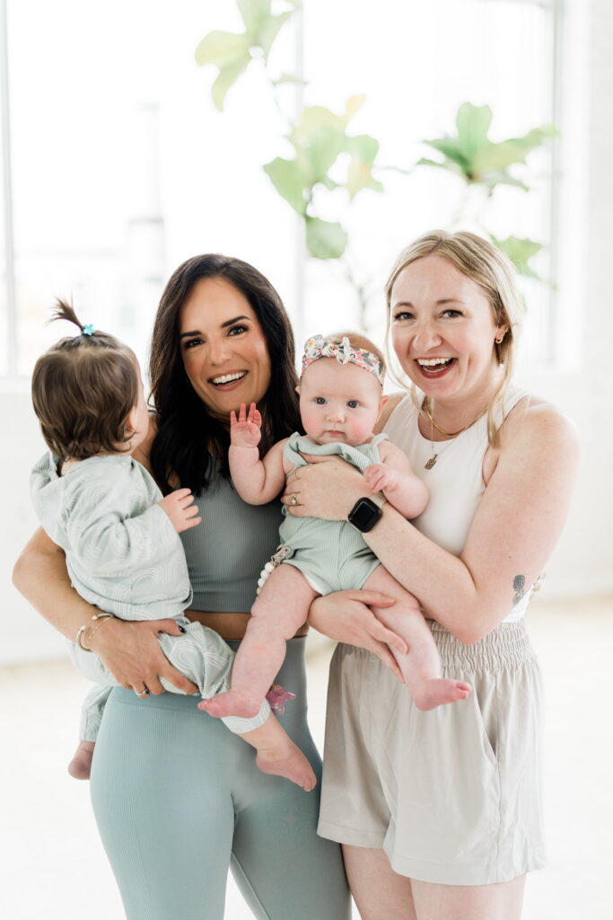 Women connecting after a prenatal fitness class in a welcoming studio